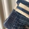 leu Indigo Shiny Niloticus Crocodile Birkin 25 Bag Front view of an artisan luxury Birkin 25 bag in Bleu Indigo shiny Niloticus crocodile leather with palladium hardware