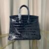 leu Indigo Shiny Niloticus Crocodile Birkin 25 Bag Front view of an artisan luxury Birkin 25 bag in Bleu Indigo shiny Niloticus crocodile leather with palladium hardware