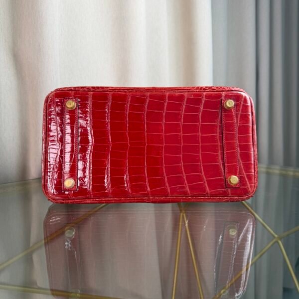 Rose Scheherazade Shiny Porosus Crocodile Birkin 30 Bag Front view of a luxury Birkin 30 bag in Rose Scheherazade shiny Porosus crocodile leather with gold hardware.