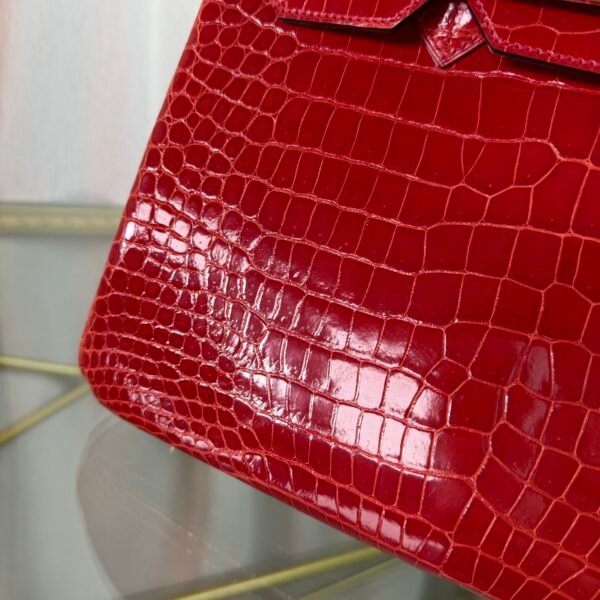 Rose Scheherazade Shiny Porosus Crocodile Birkin 30 Bag Front view of a luxury Birkin 30 bag in Rose Scheherazade shiny Porosus crocodile leather with gold hardware.
