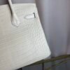 Glacier White Matte Alligator Birkin 30 Bag Front view of a luxury Birkin 30 bag in Glacier White matte Alligator leather with palladium hardware.
