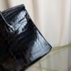 Black Shiny Niloticus Crocodile Birkin 30 Bag Front view of a luxury Birkin 30 bag in Black shiny Niloticus crocodile leather with palladium hardware.