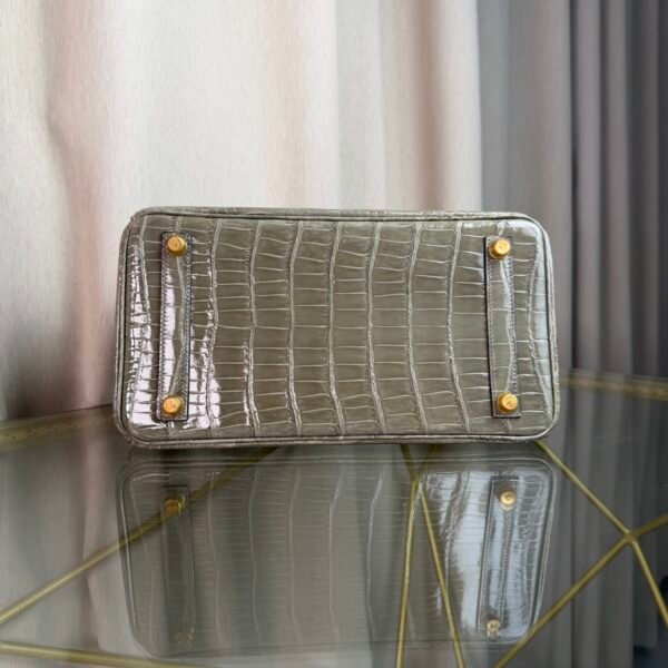 Gris Tourterelle Shiny Porosus Crocodile Birkin 30 Bag Front view of a luxury Birkin 30 bag in Gris Tourterelle shiny Porosus crocodile leather with gold hardware.