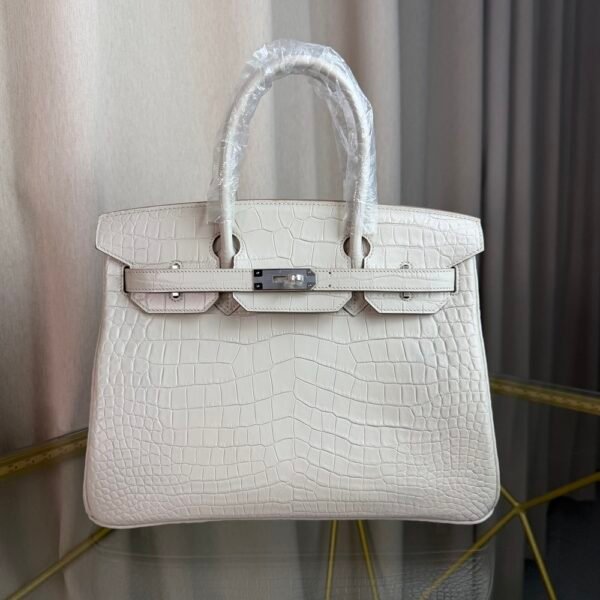 Blanc Matte Alligator Birkin 30 Bag Front view of a luxury Birkin 30 bag in Blanc matte Alligator leather with palladium hardware.