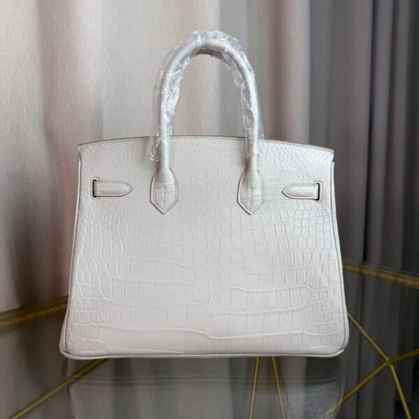 Blanc Matte Alligator Birkin 30 Bag Front view of a luxury Birkin 30 bag in Blanc matte Alligator leather with palladium hardware.