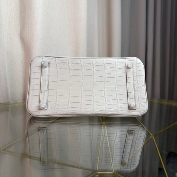 Blanc Matte Alligator Birkin 30 Bag Front view of a luxury Birkin 30 bag in Blanc matte Alligator leather with palladium hardware.