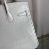 Blanc Matte Alligator Birkin 30 Bag Front view of a luxury Birkin 30 bag in Blanc matte Alligator leather with palladium hardware.