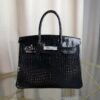 Black Shiny Porosus Crocodile Birkin 35 Diamond Hardware Bag Front view of an ultra-luxury Birkin 35 bag in Black shiny Porosus crocodile leather with 18k white gold diamond hardware.