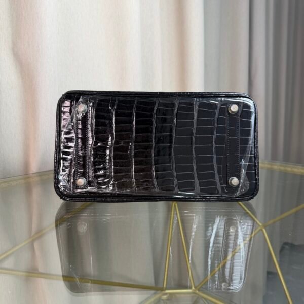 Black Shiny Porosus Crocodile Birkin 35 Diamond Hardware Bag Front view of an ultra-luxury Birkin 35 bag in Black shiny Porosus crocodile leather with 18k white gold diamond hardware.