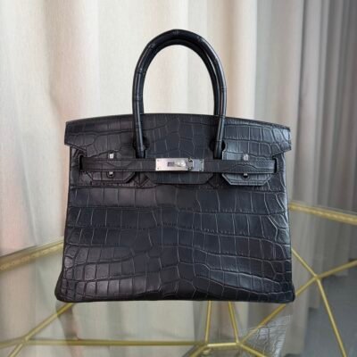 Black Matte Niloticus Crocodile Birkin 30 Bag Front view of a luxury Birkin 30 bag in Black matte Niloticus crocodile leather with palladium hardware.