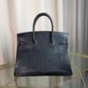 Black Matte Niloticus Crocodile Birkin 30 Bag Front view of a luxury Birkin 30 bag in Black matte Niloticus crocodile leather with palladium hardware.