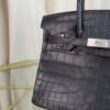 Black Matte Niloticus Crocodile Birkin 30 Bag Front view of a luxury Birkin 30 bag in Black matte Niloticus crocodile leather with palladium hardware.
