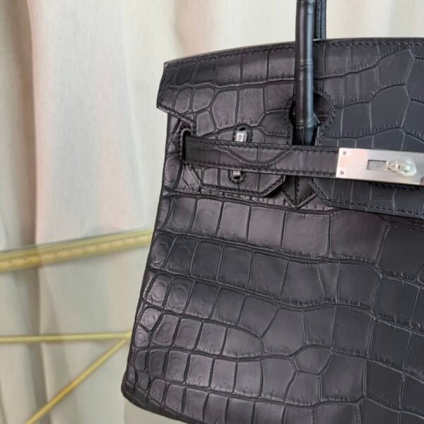 Black Matte Niloticus Crocodile Birkin 30 Bag Front view of a luxury Birkin 30 bag in Black matte Niloticus crocodile leather with palladium hardware.