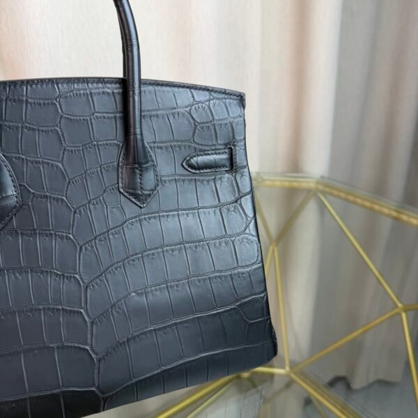 Black Matte Niloticus Crocodile Birkin 30 Bag Front view of a luxury Birkin 30 bag in Black matte Niloticus crocodile leather with palladium hardware.