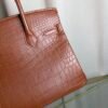 Gold Matte Niloticus Crocodile Birkin 30 Bag Front view of a luxury Birkin 30 bag in Gold matte Niloticus crocodile leather with gold hardware.