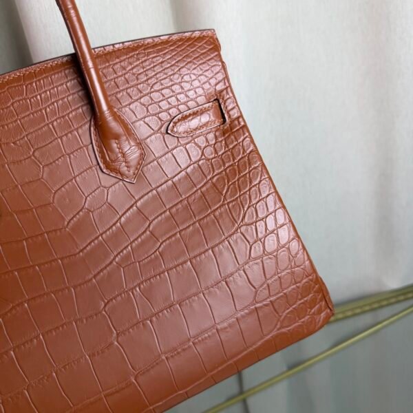 Gold Matte Niloticus Crocodile Birkin 30 Bag Front view of a luxury Birkin 30 bag in Gold matte Niloticus crocodile leather with gold hardware.